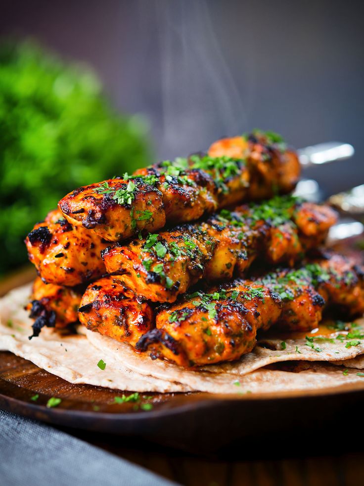 chicken tikka kebab skewers in an indian yoghurt…